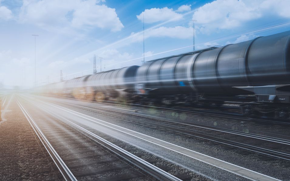 Train of tank wagons speeds past