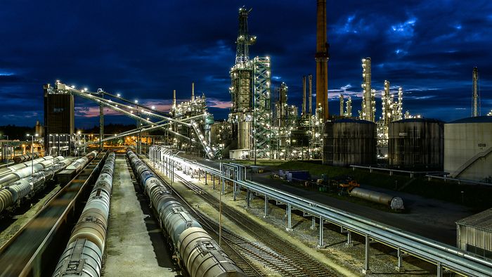 Refinery and rail tracks by night