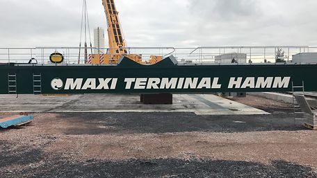 A crane bearing the name Maxi Terminal Hamm