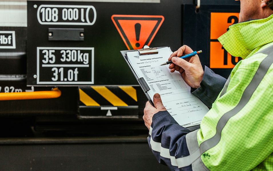 A man fills in a form.