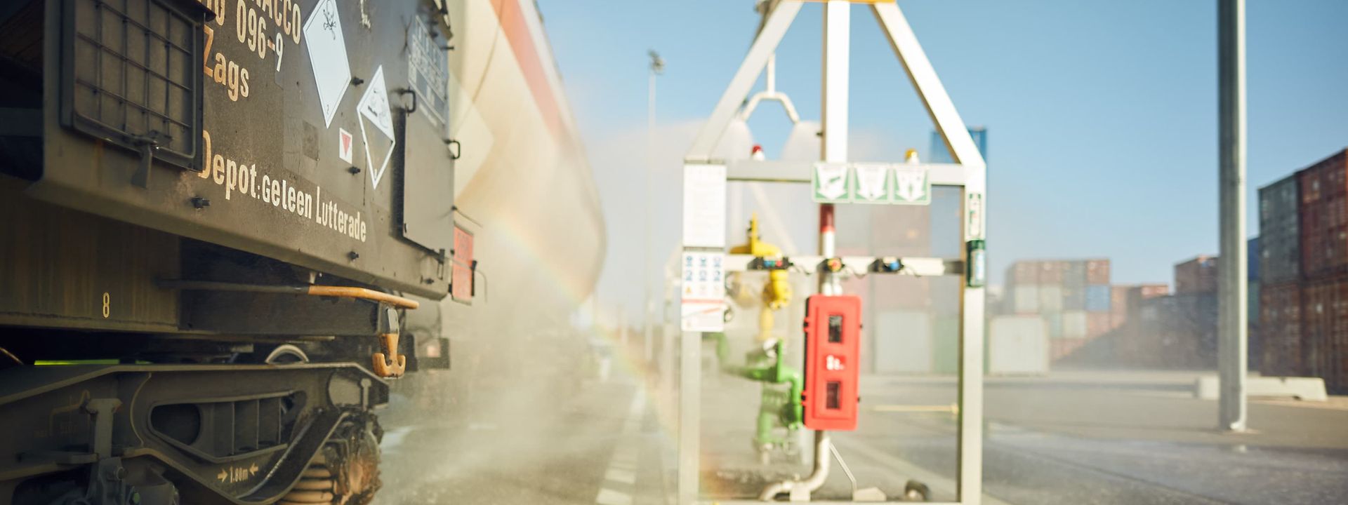 A tank wagon filling station with a sprinkler system